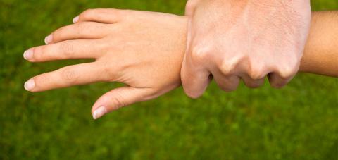 Wrist being grabbed by a hand