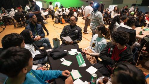Youths in discussion with community leaders.
